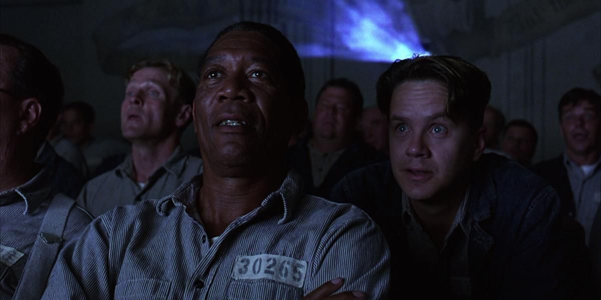 Red and Andy talking during a movie in The Shawshank Redemption