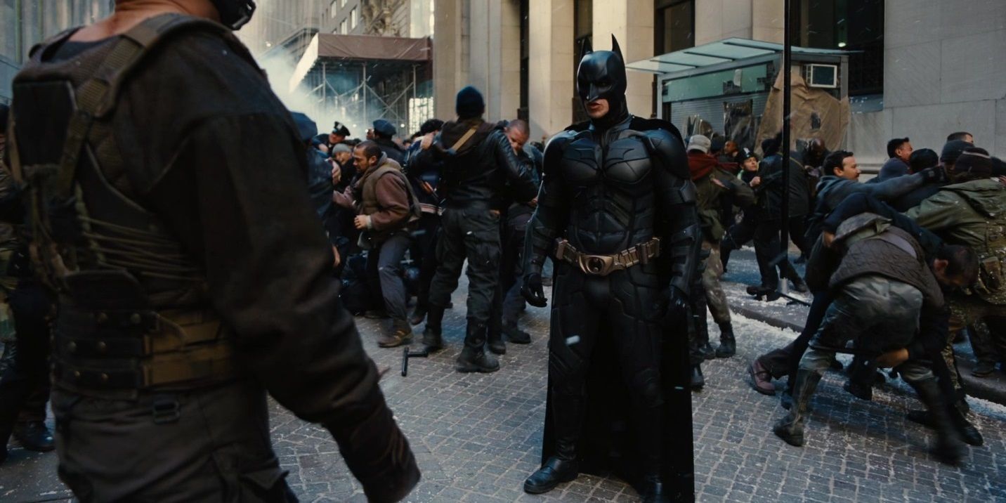 Batman and Bane face off on an open street in The Dark Knight Rises