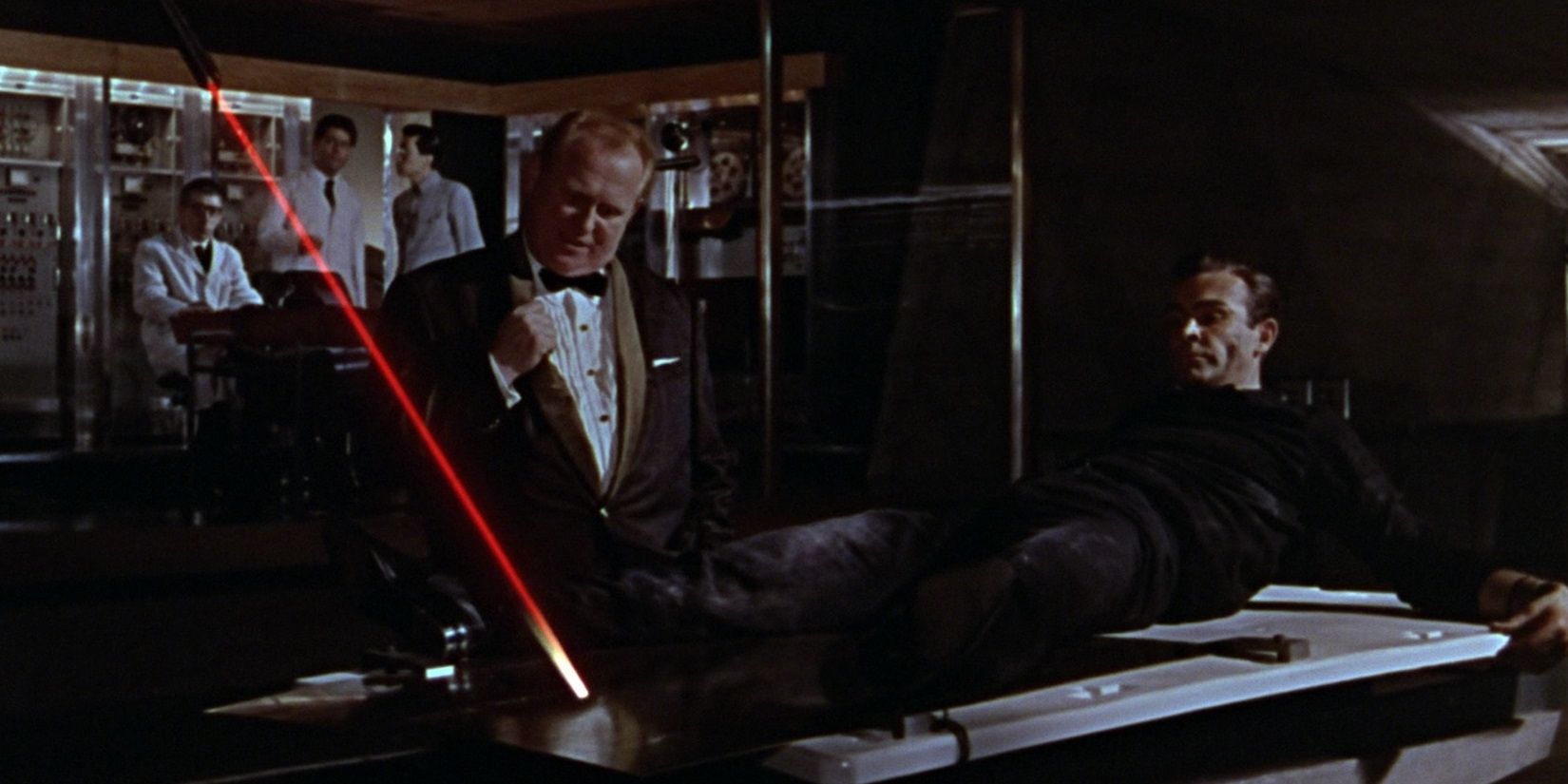 Auric Goldfinger tries to cut Bond in half using a laser