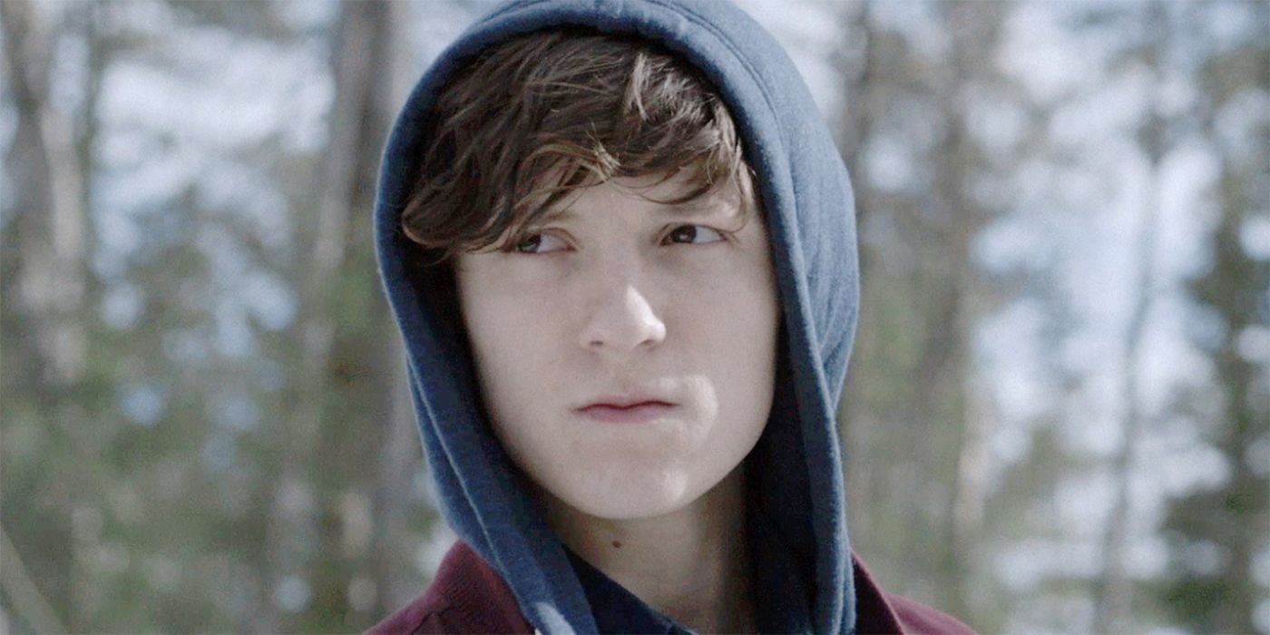 A young boy looking serious in The Edge of Winter