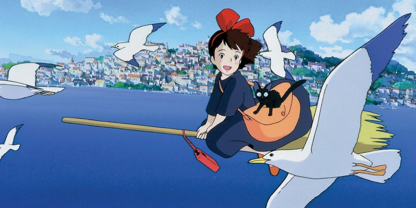 Kiki flies on her broom with Jiji next to some seagulls in Kiki's Delivery Service