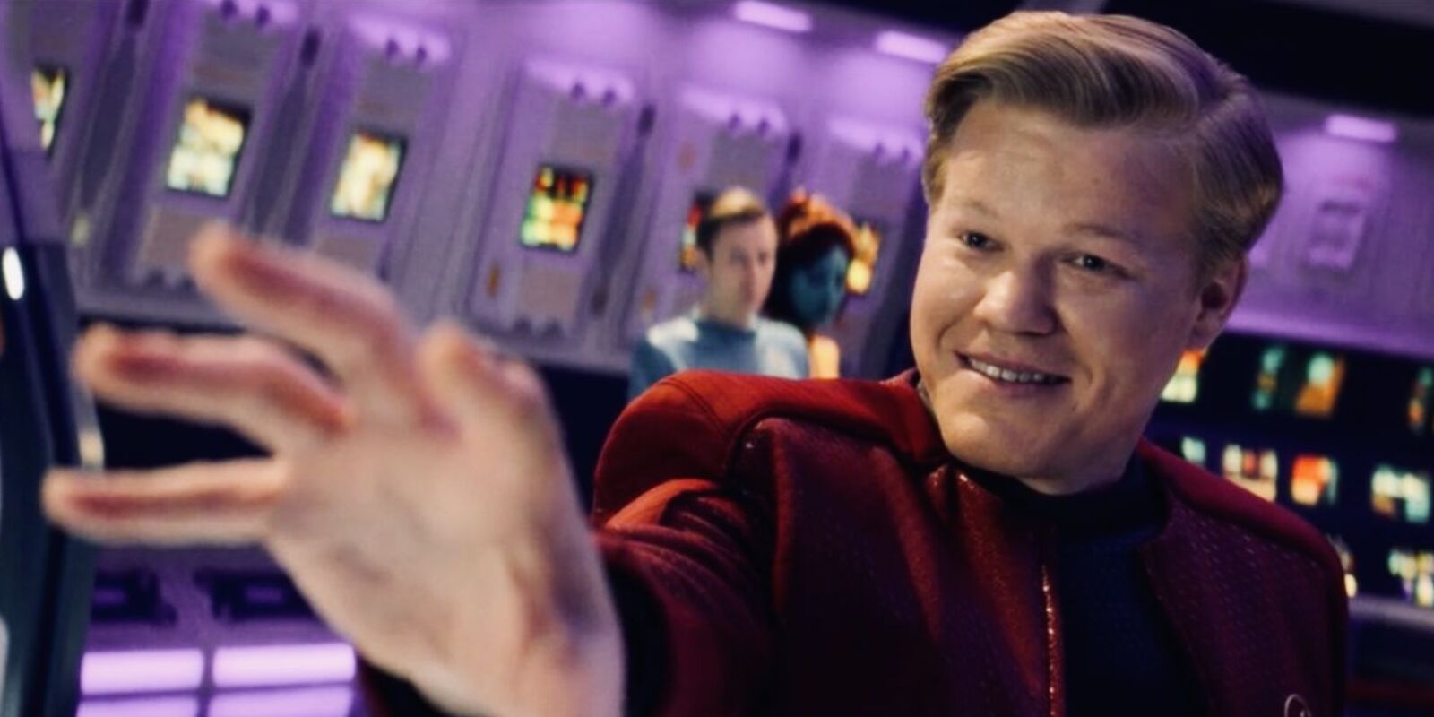 Jesse Plemons as Daly with his arm out while sitting in the captain's car in Black Mirror's USS Callister