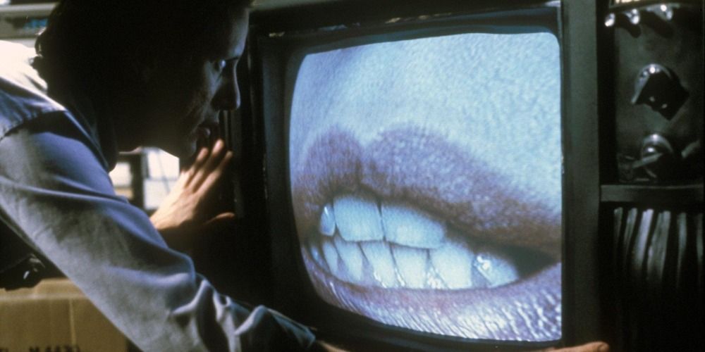 James Woods in Videodrome looking at lips on the TV screen