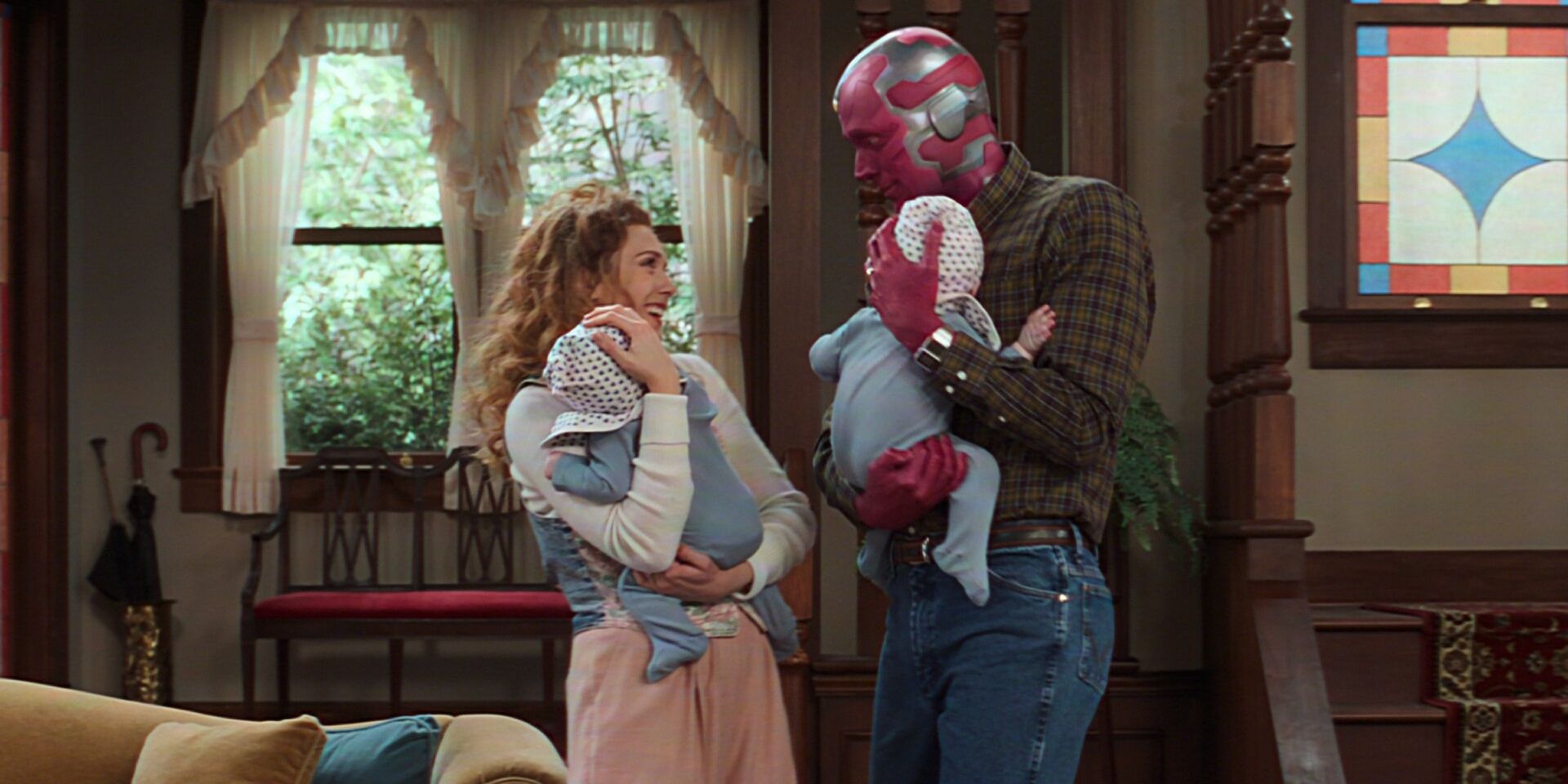 Wanda and Vision holding their babies in WandaVision