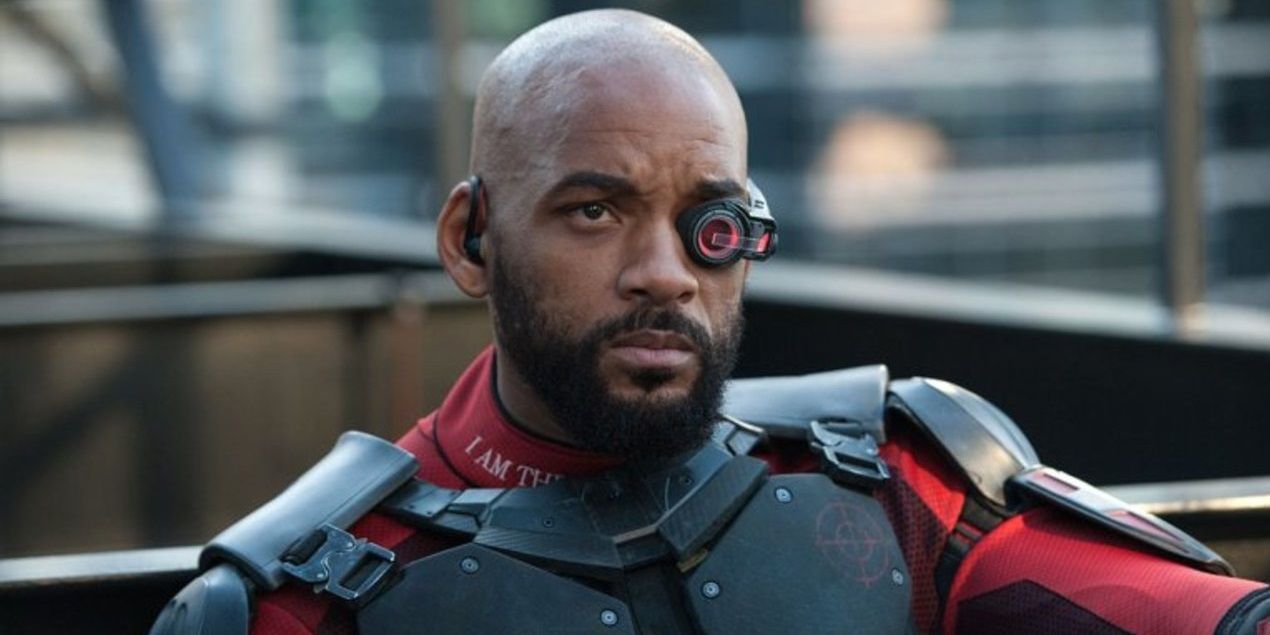 Deadshot snipes a target from a rooftopin Suicide Squad