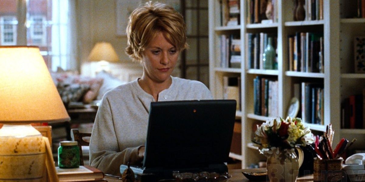 Kathleen typing on her computer in You've Got Mail