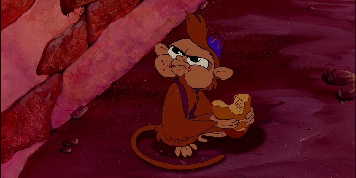 Abu with a piece of bread in 'Aladdin'