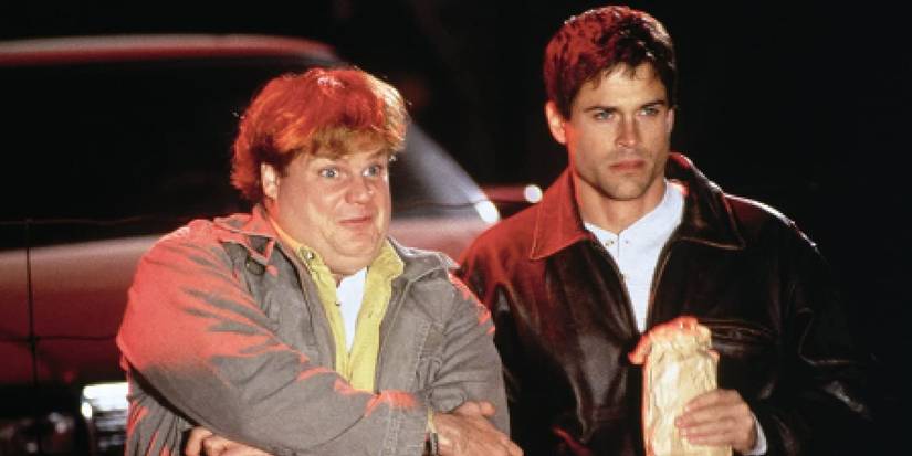 Tommy (Chris Farley) and Paul (Rob Lowe) staring at something in Tommy Boy.