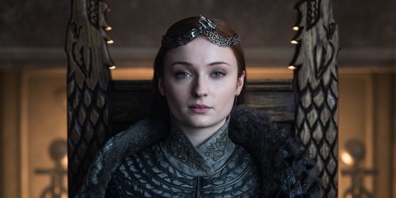Sansa Stark wearing her crown and looking solemn in Game of Thrones.