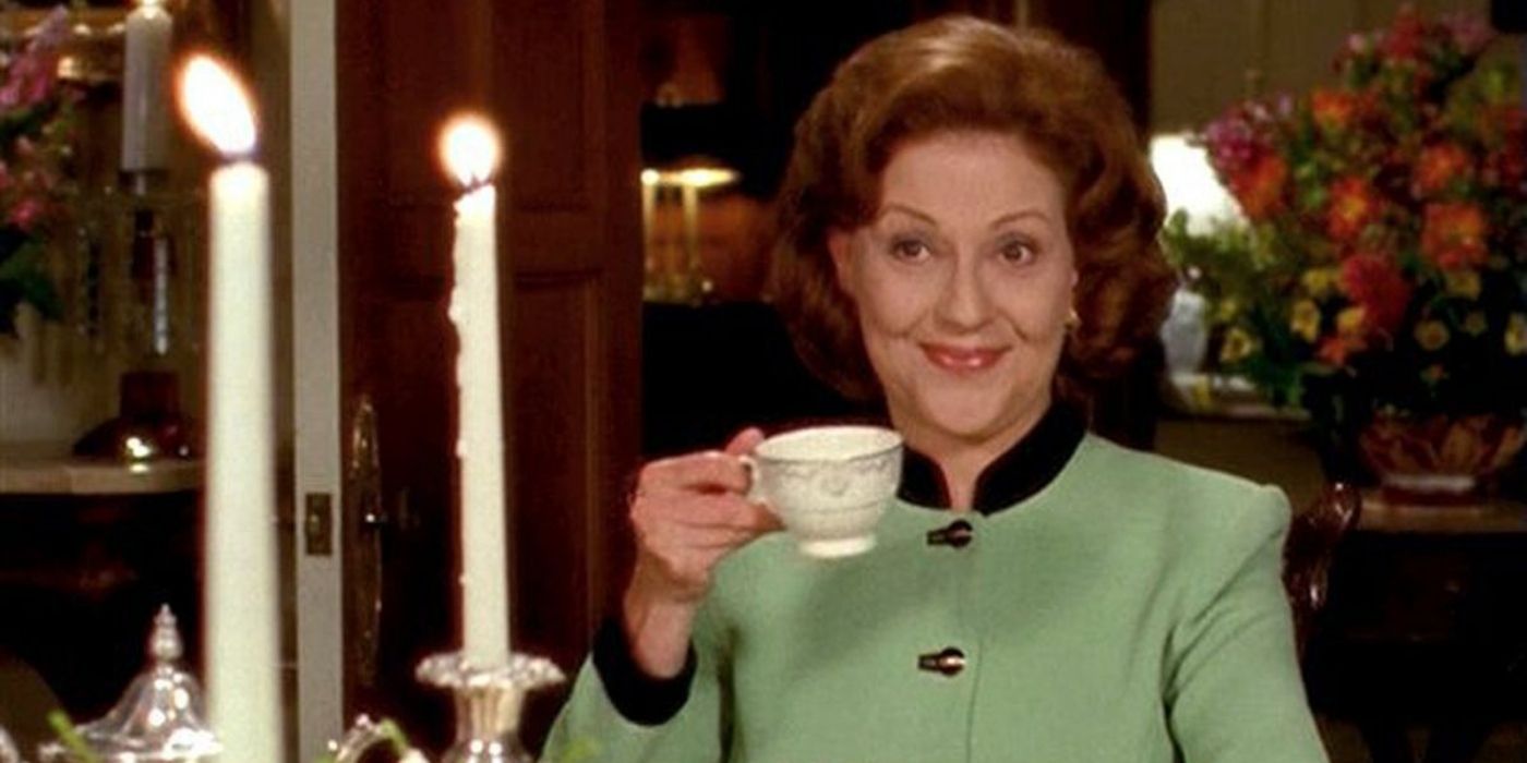 Emily Gilmore holding a teacup and smiling in Gilmore Girls