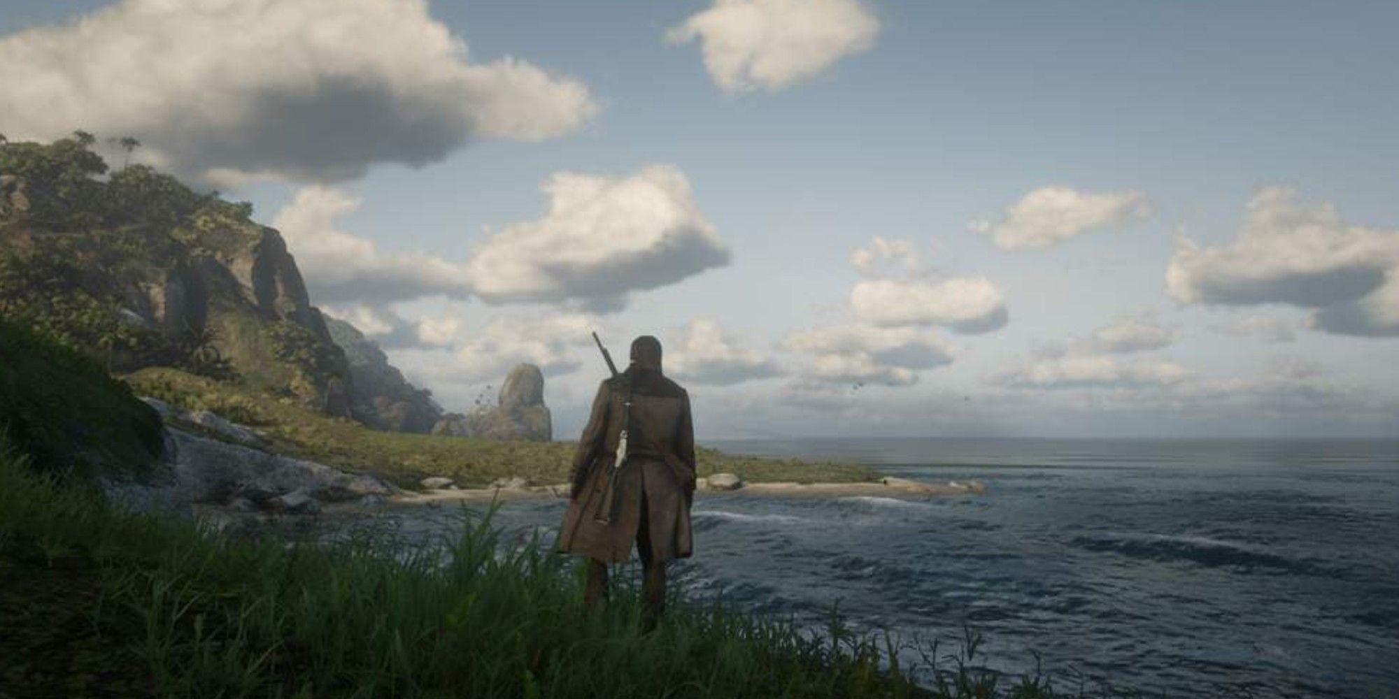 Arthur Morgan parado em uma encosta em Guarma em Red Dead Redemption 2