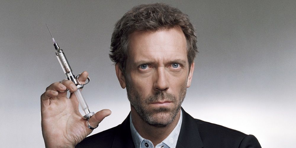 Gregory House holds a syringe up in House