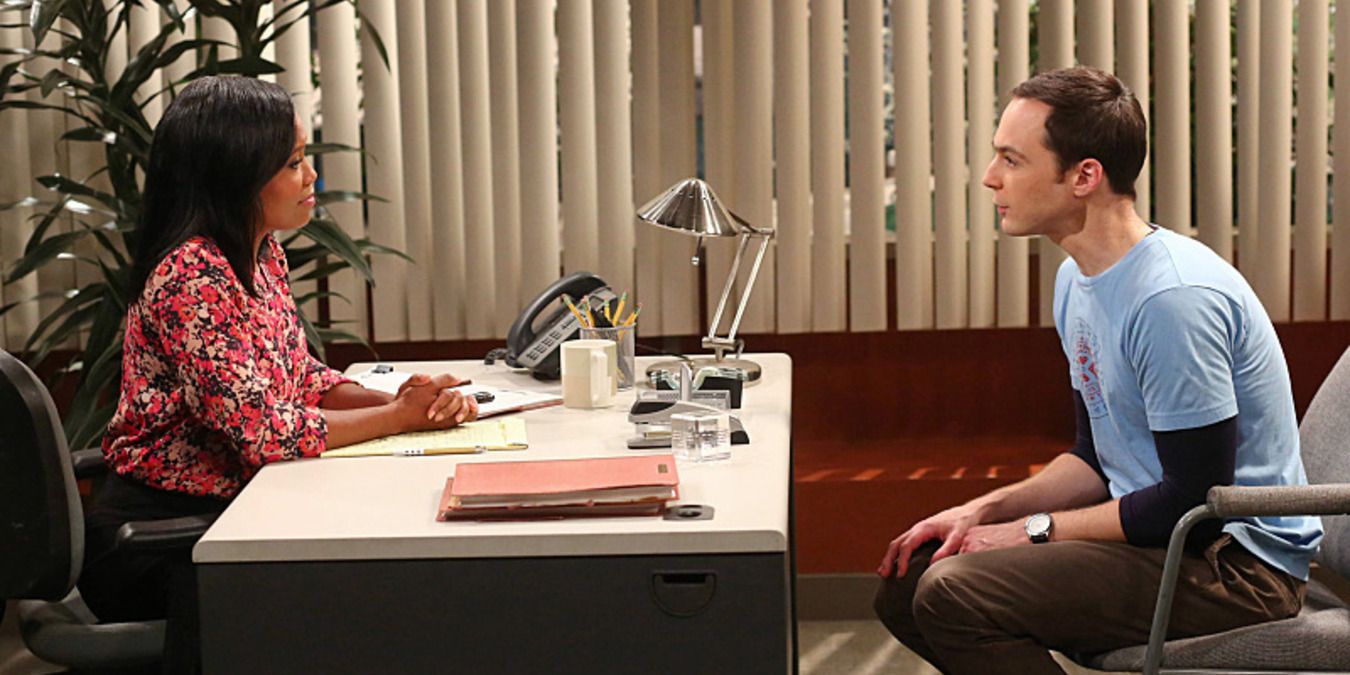 Janine Davis sitting with Sheldon in her office on The Big Bang Theory