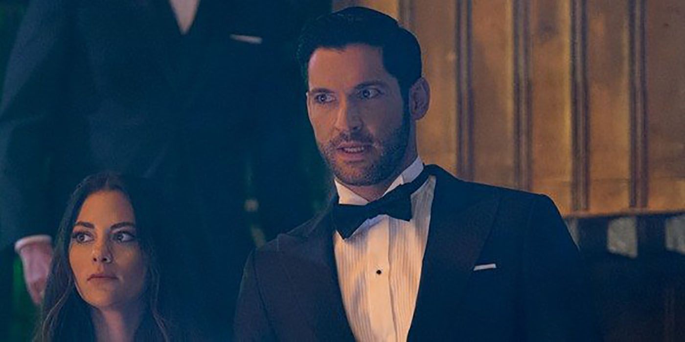 Lucifer in a black tux with a bowtie and Eve on his arm.