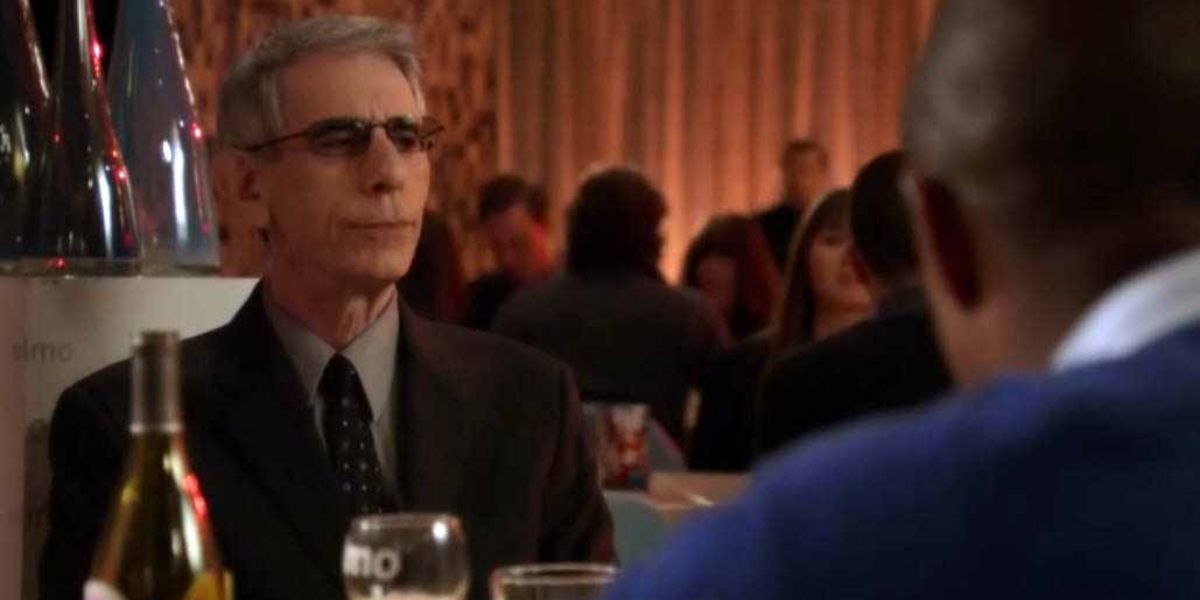 Munch and Ken sitting at a table in Law and Order SVU
