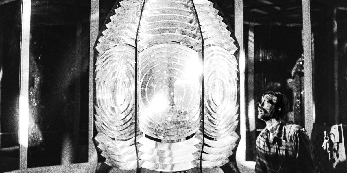 Robert Pattinson next to the lamp used in the film