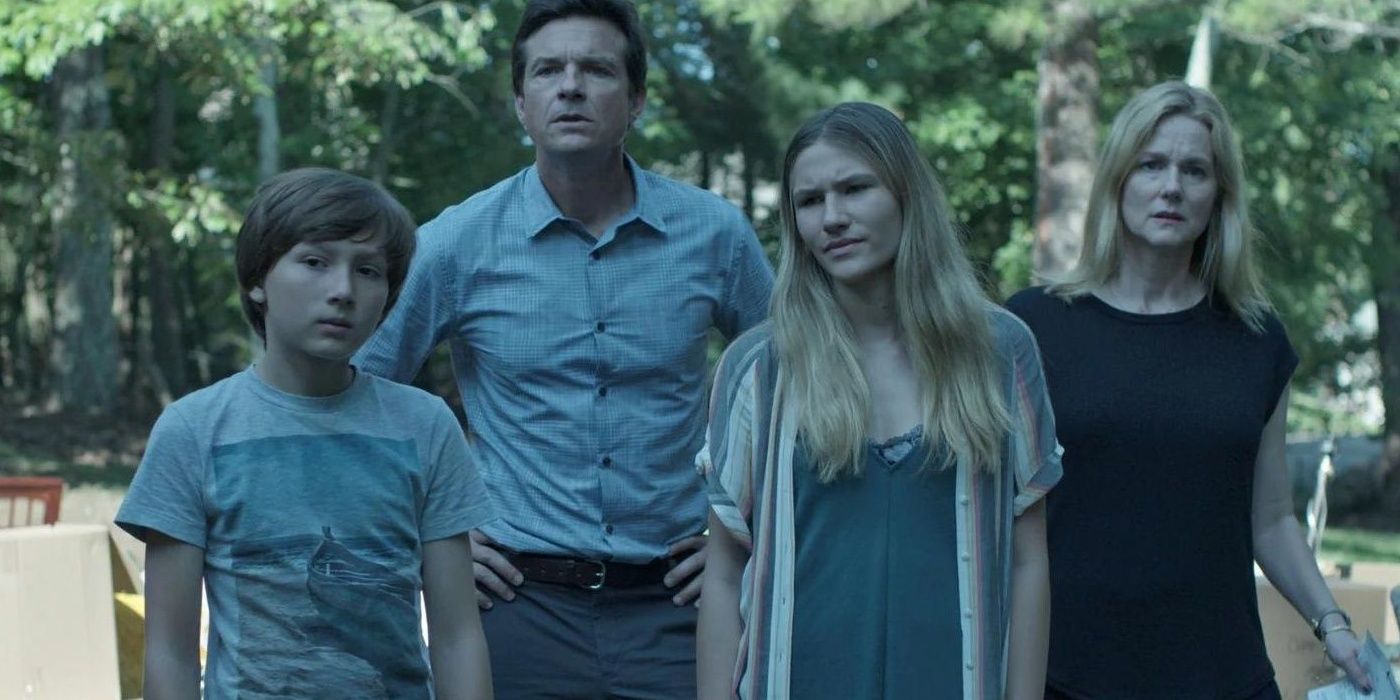 The Byrde family stands outside and looks forward in Ozark