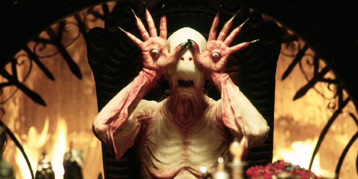 The Pale Man from Pans Labyrinth in front of a fire
