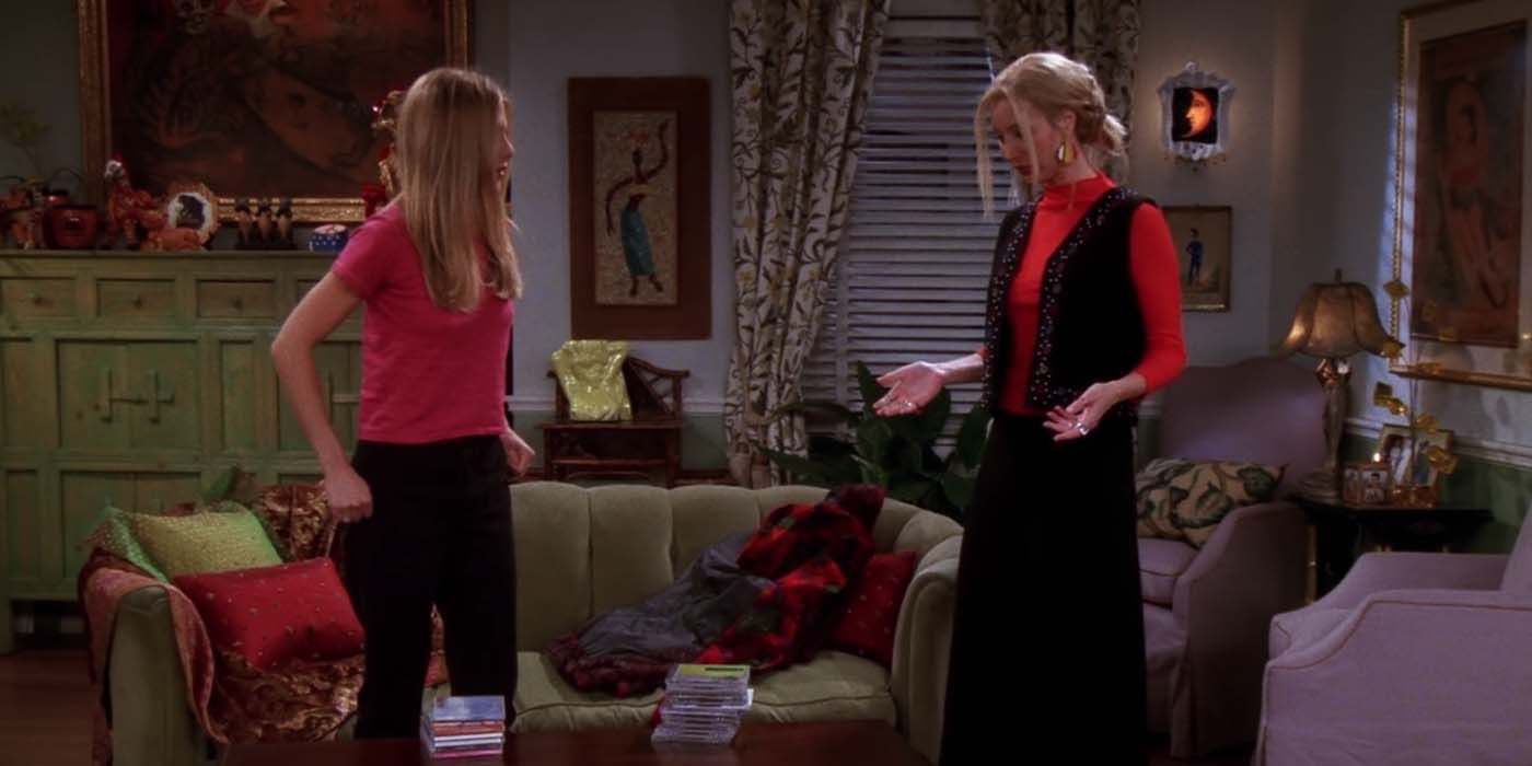 Rachel and Phoebe in the living room talking in Friends.