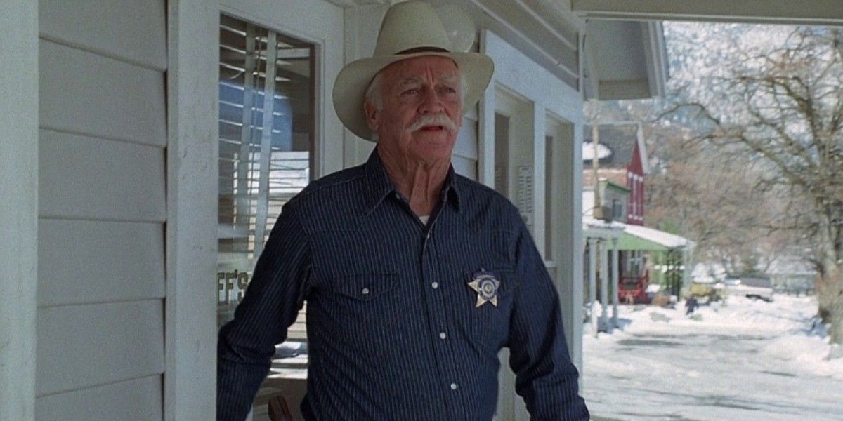 Sheriff Buster coming out of his office in Misery 1990