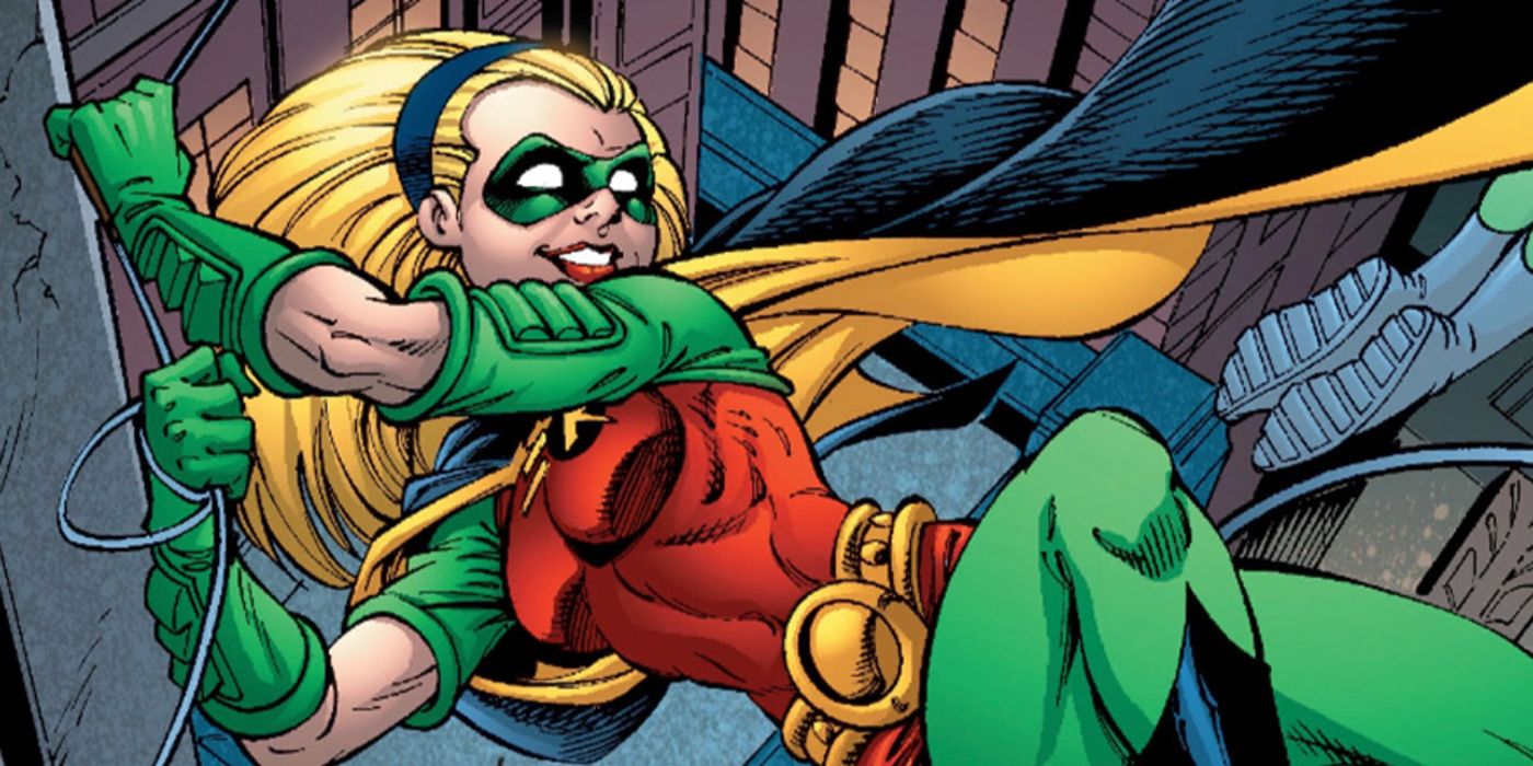 Stephanie Brown in her Robin costume swinging on a rope