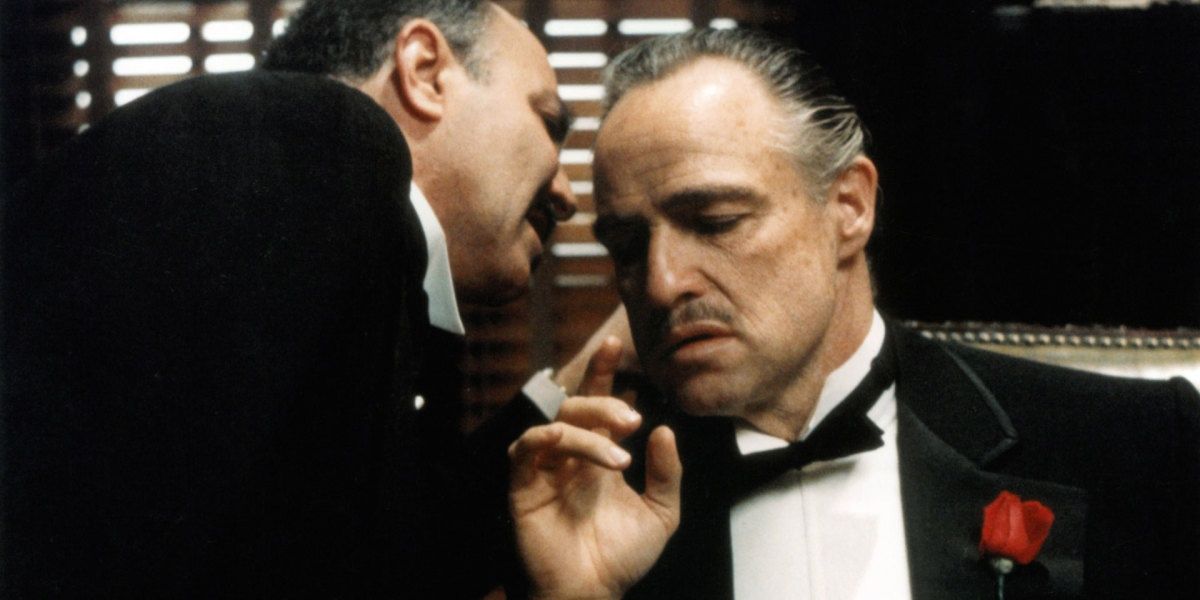 Marlon Brando as Don Corleone speaking to a friend in the godfather