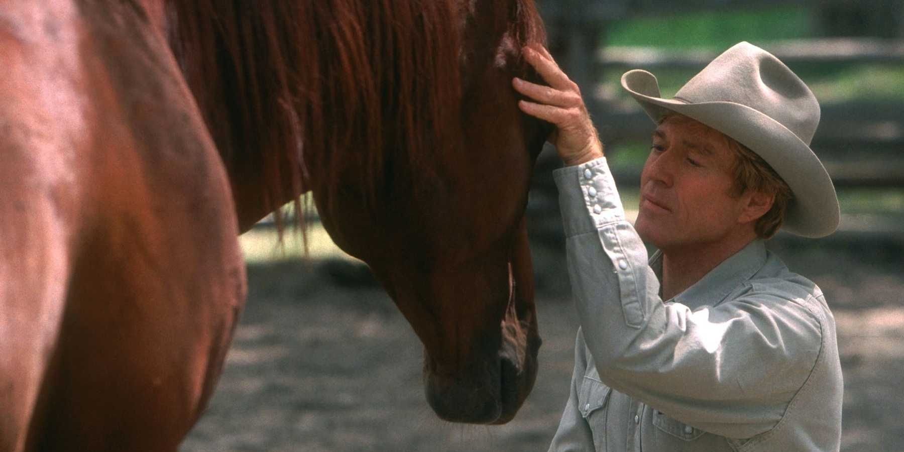 Robert Redford whispering to a horse in The Horse Whisperer