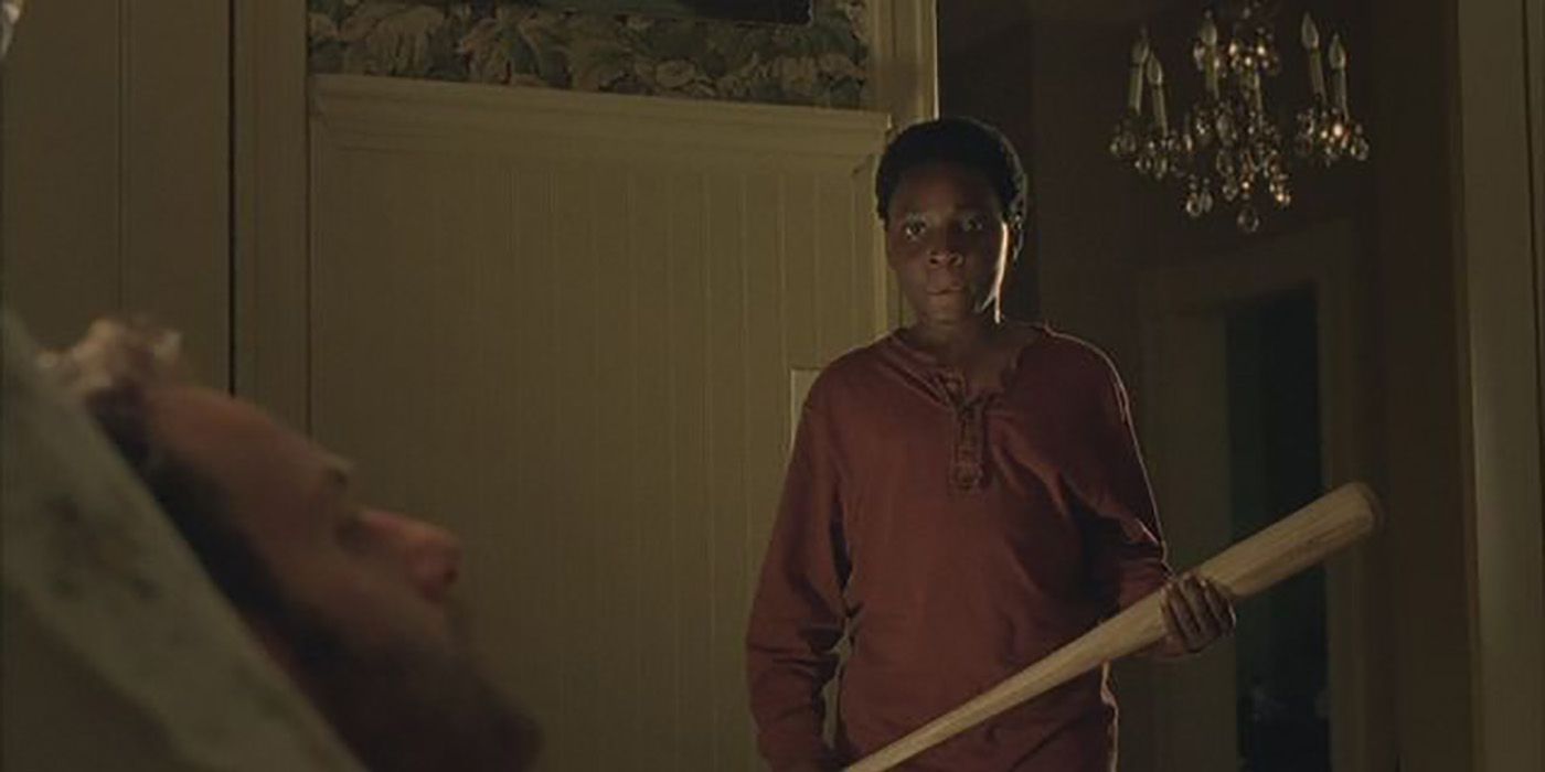 Duane from The Walking Dead greeting Rick with a bat.