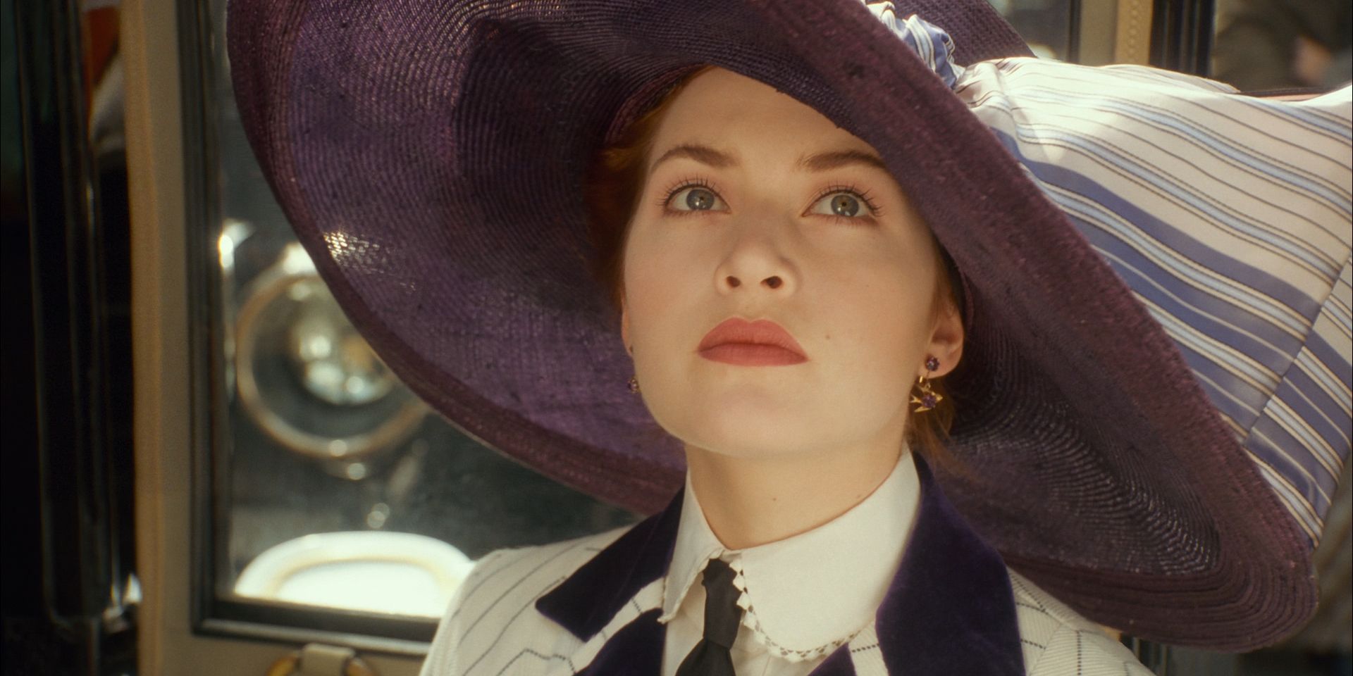 Rose Looks up at the Titanic from under her huge purple hat in Titanic