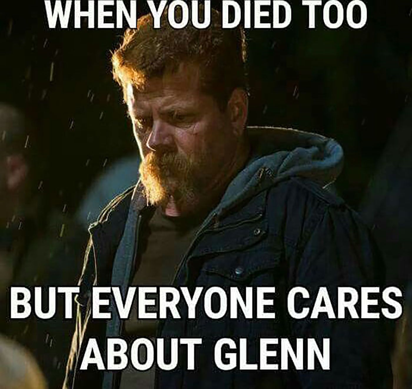 Meme of Abraham from The Walking Dead, looking sad, standing in the rain.