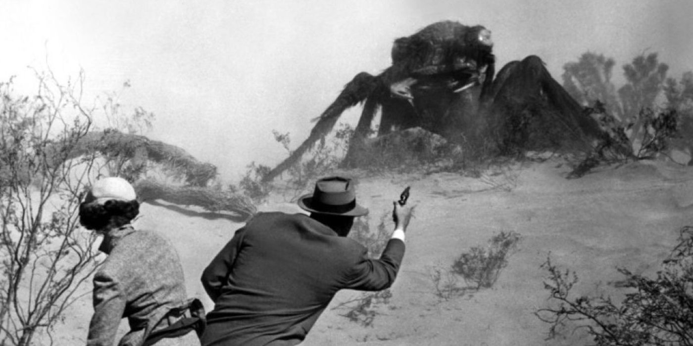 man shooting giant ant
