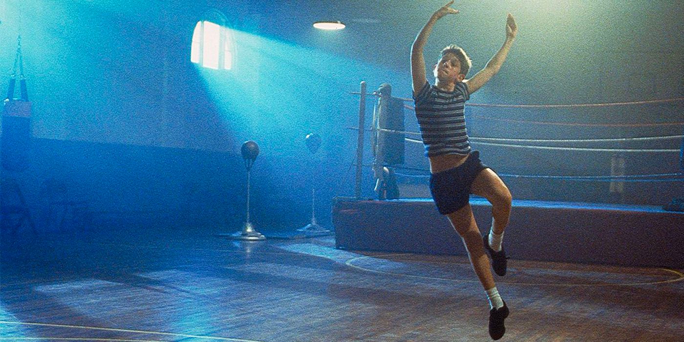 Scene from Billy Elliot with Billy dancing in front of boxing ring 