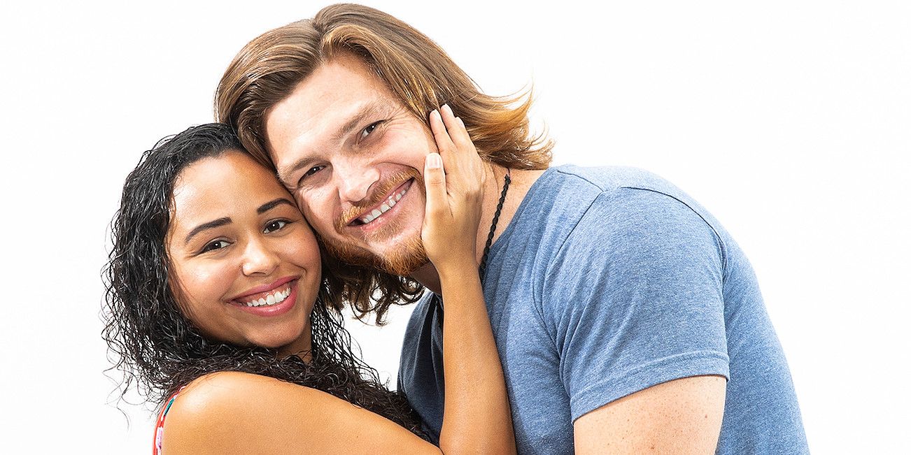 Tania and Syngin pose for a photo while smiling on 90 Day Fiancé