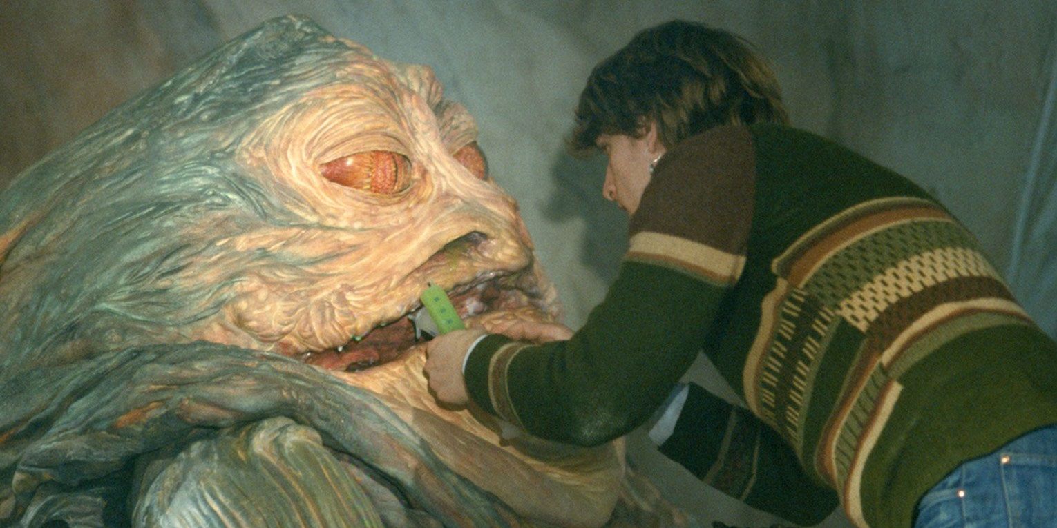 A special effects technician working on Jabba the Hutt