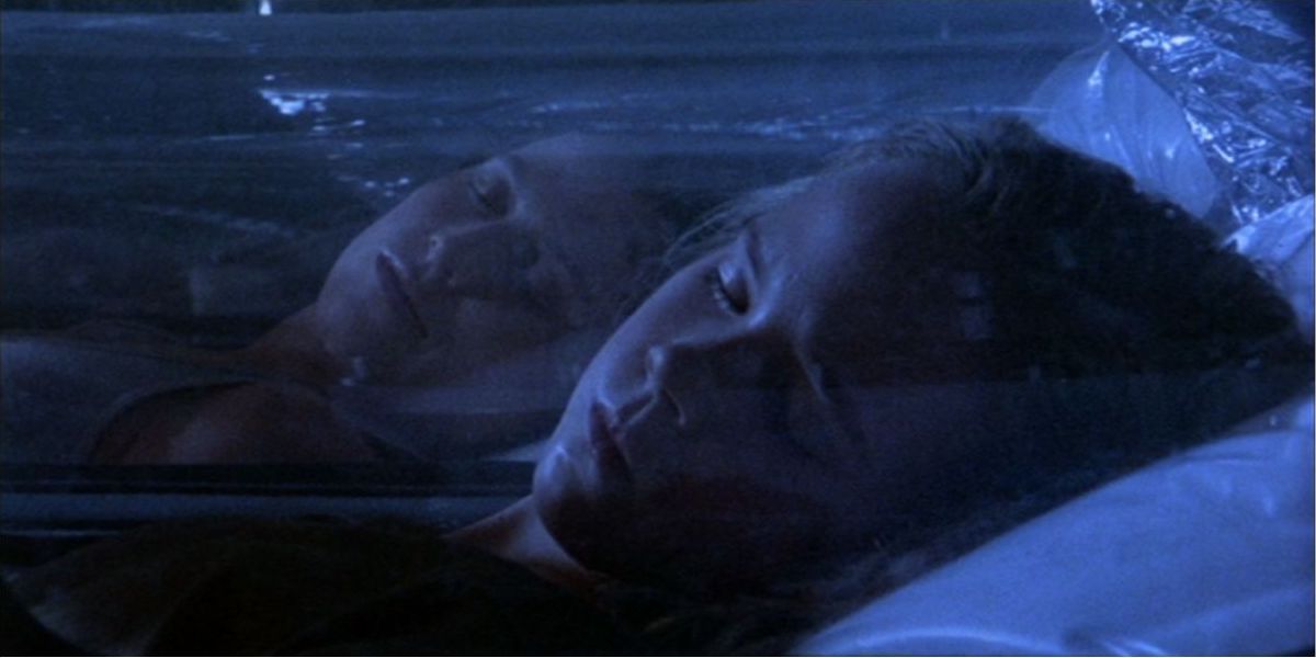 Ripley and Newt sleeping side by side