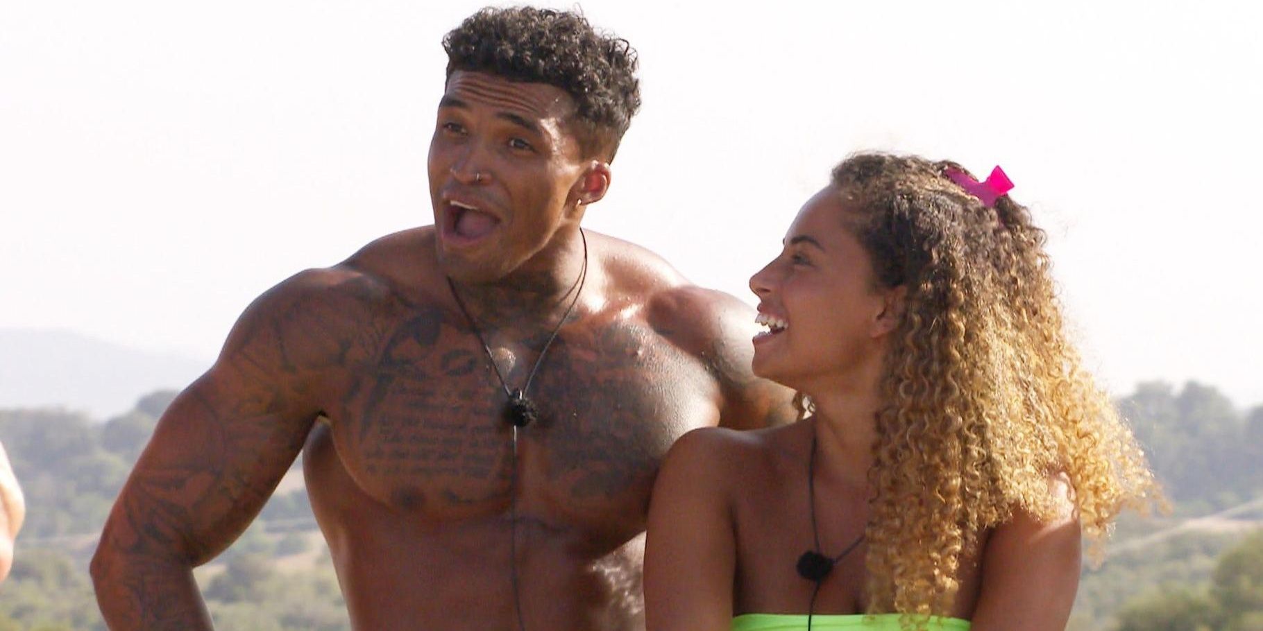 Amber Gill And Michael Griffiths laughing together on Love Island
