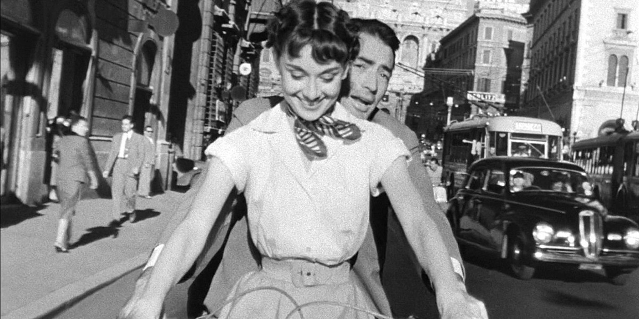 Ann and Joe ride a Vespa in Roman Holiday