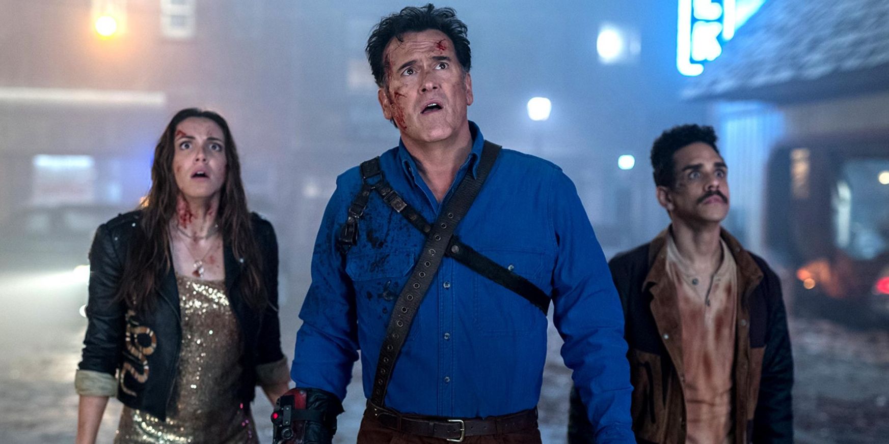 Ash, Mia, and Pablo look up while being injured in a still from Ash vs Evil Dead