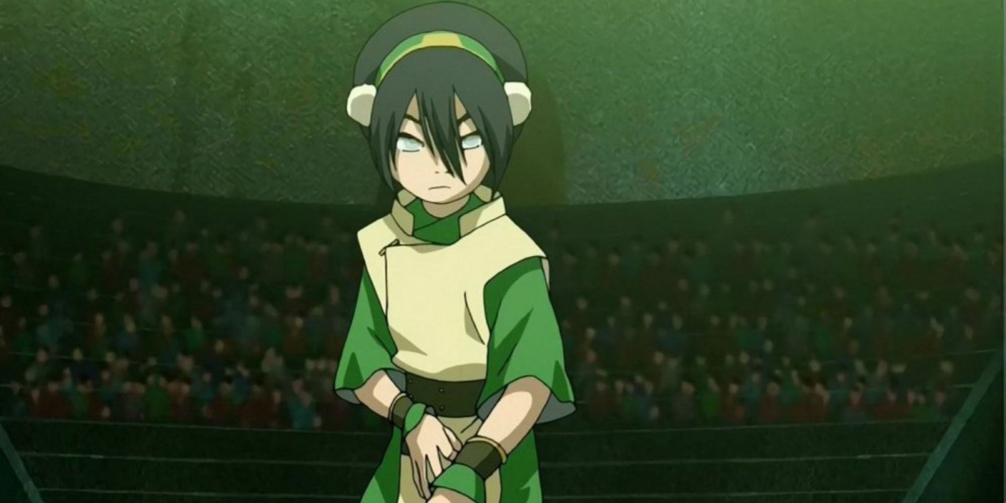 A profile screenshot of Toph in a ready stance from Avatar: The Last Airbender