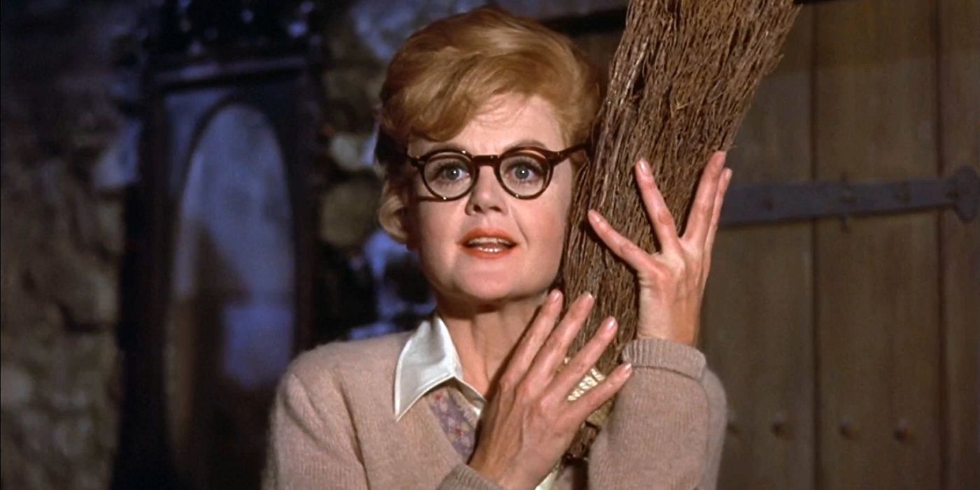 Ms. Price in Bedknobs and Broomsticks, holding her broomstick.