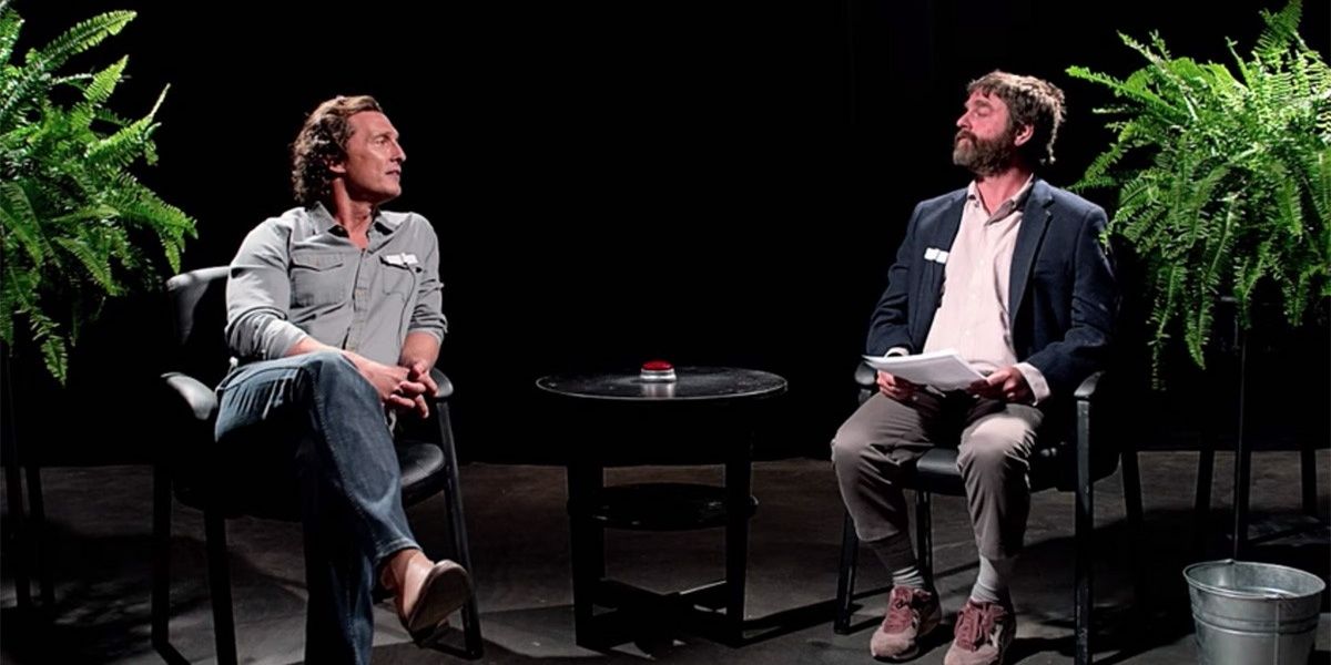 Matthew McConaughey and Zach Galifianakis sitting on chairs and talking to each other in Between Two Ferns