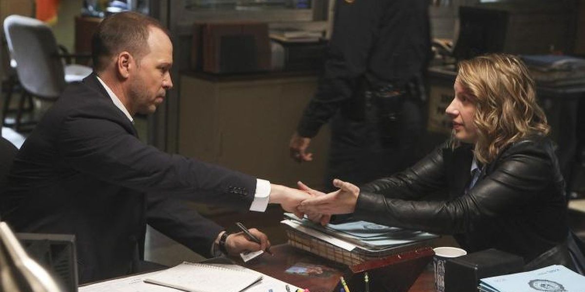 Danny with a woman at his office in Blue Bloods