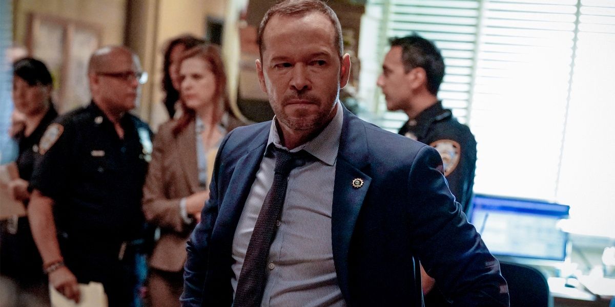 Danny, looking angry with people in the background in Blue Bloods