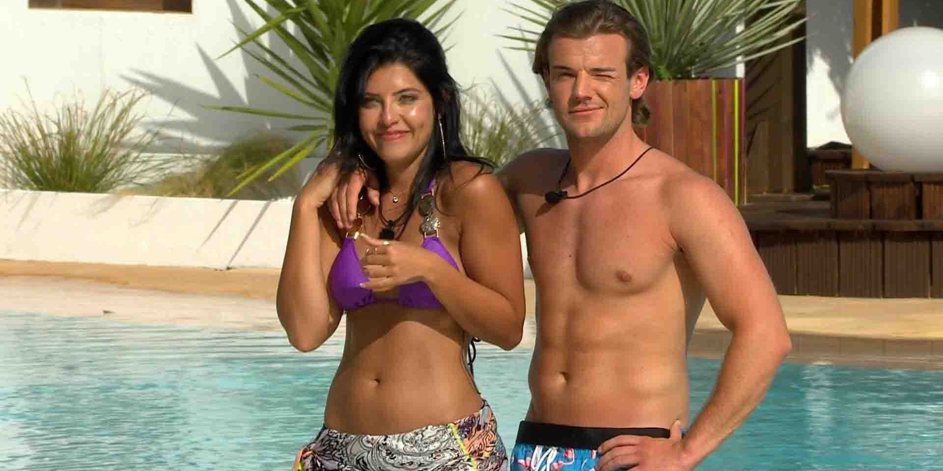 Cara and Nathan pose for a picture side by side in front the pool in Love Island UK season 2.