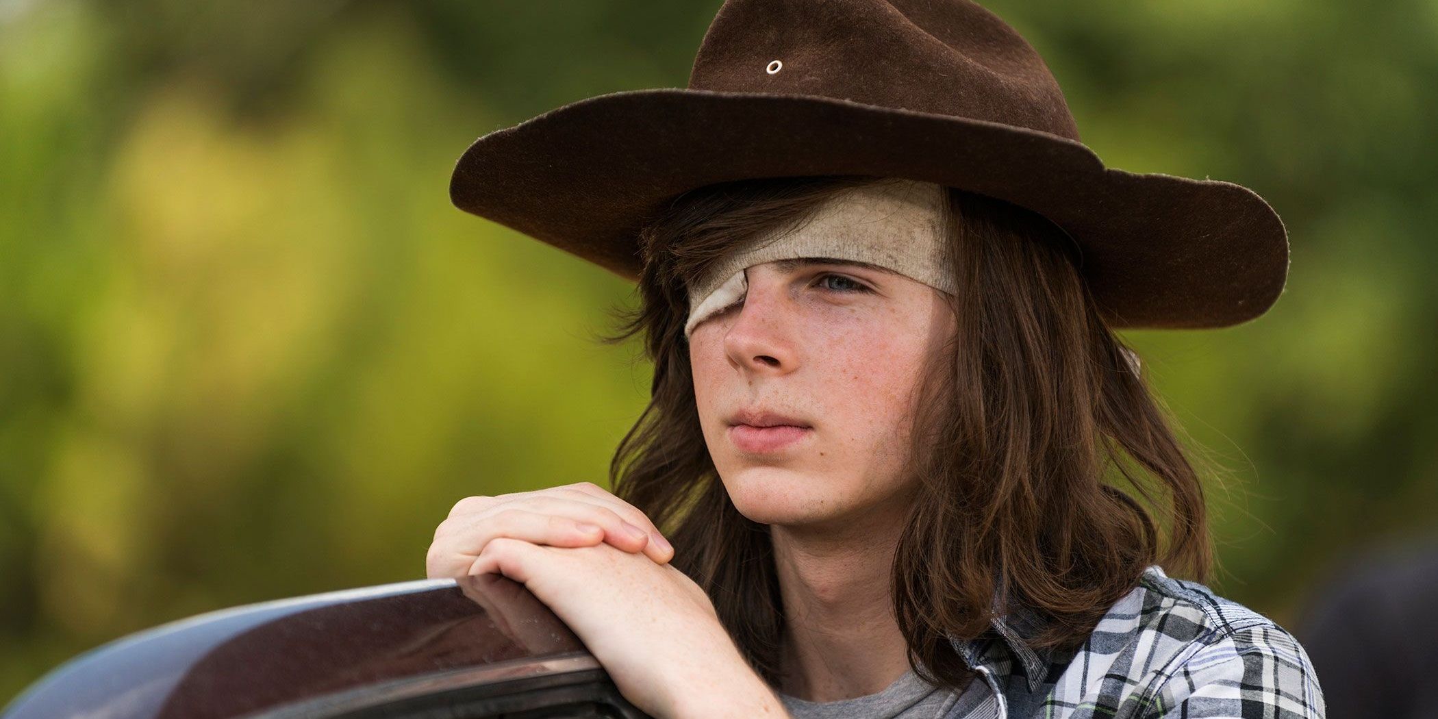 Carl Grimes looking to the distance on The Walking Dead
