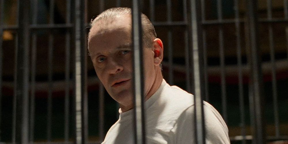 Hannibal Lecter looks through his prison bars