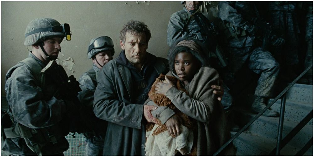 Man And Woman With Baby Going Through Crowd