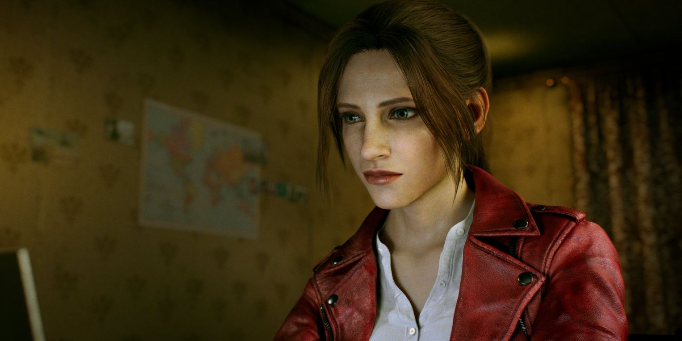 Claire sits at a computer in Resident Evil.