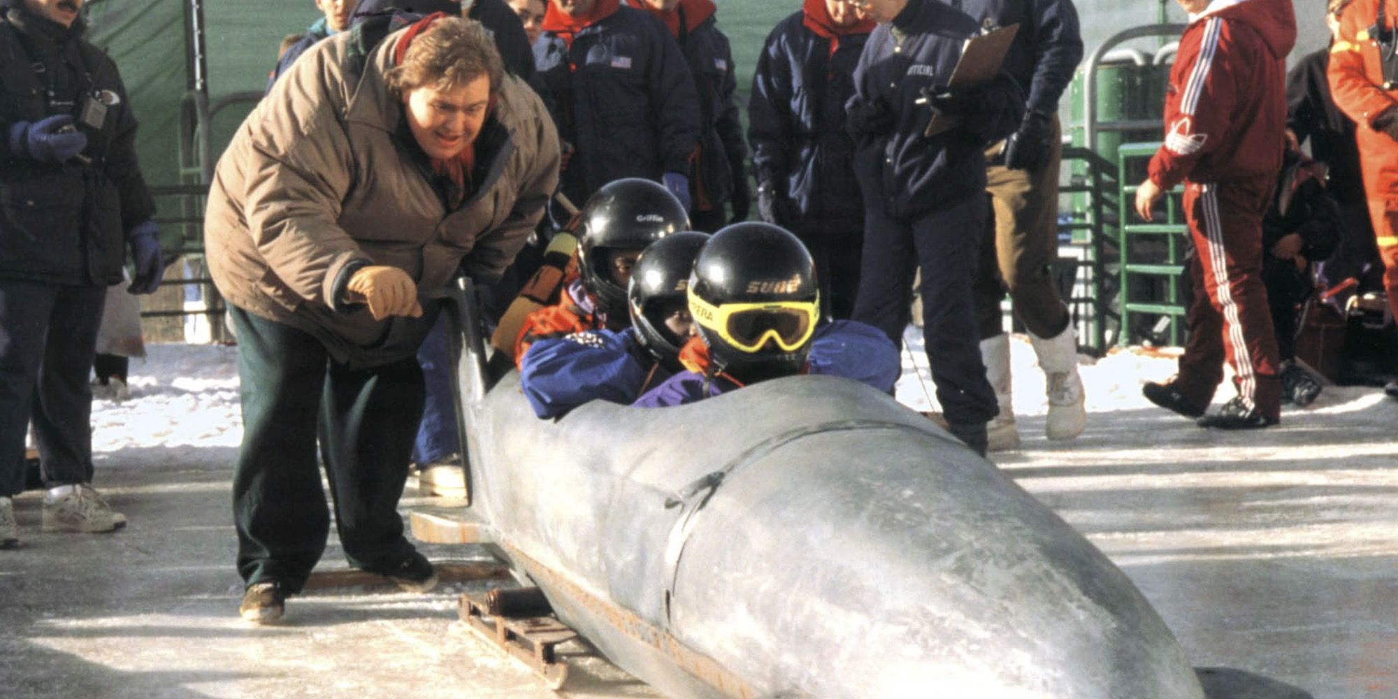 John Candy pushing a bobsled in Cool Runnings