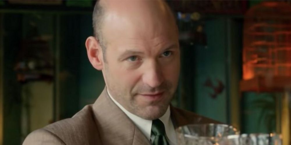 Corey Stoll offering a drink in Ratched